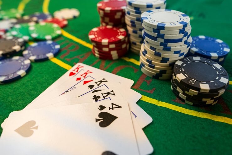 Live blackjack dealer at admin77 studio with HD camera feeds and card shoe visible